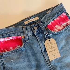Denim levis jeans. With tie dye pocket decor.